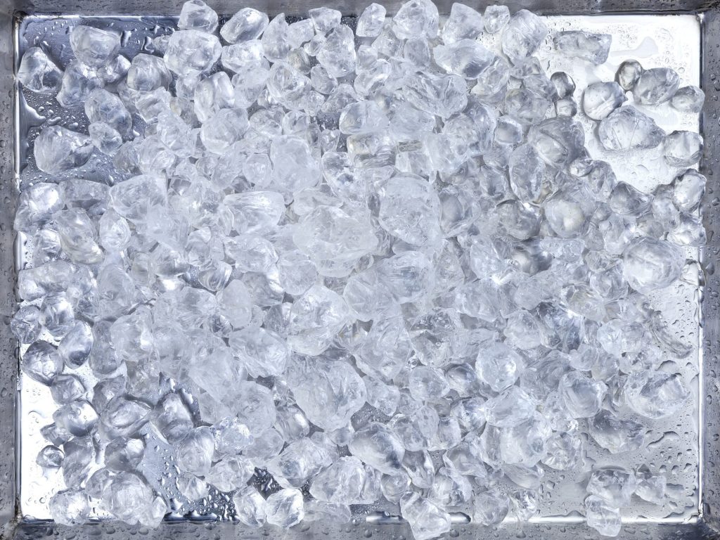 an ice bin filled to the top with clear cubes, seen straight down — the record is the dual auto ice maker page